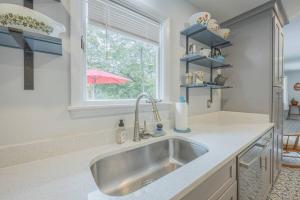 a kitchen with a sink and a window at Restful Riverside Residence w Firepit in Athens +27 photos