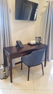 Μια τηλεόραση ή/και κέντρο ψυχαγωγίας στο Coastal Boutique Hotel