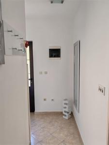 a hallway with white walls and a stair case at Apartment Seman in Vela Luka +17 photos
