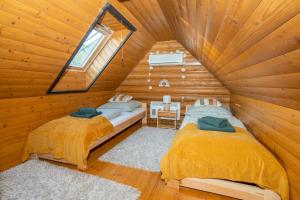 Postel nebo postele na pokoji v ubytování Messzelátó Vendégház