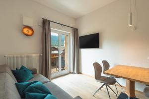 a living room with a couch and a table at Kriendl Nr 4 in Valdaora