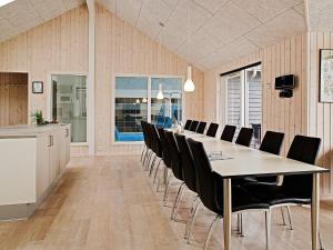 a dining room with a long table and chairs at 5 star holiday home in Kappeln in Kappeln