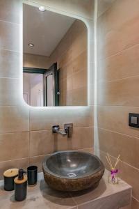 a bathroom with a large wooden sink and a mirror at Seaside Suite in Galissas +30 photos