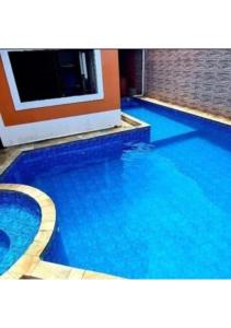 Bazén v ubytování Pousada MakTub Beach House Itanhaém nebo v jeho okolí + 24 fotografií