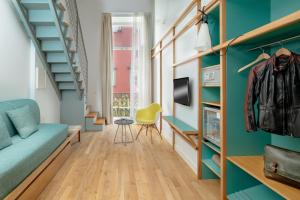 TV a/nebo společenská místnost v ubytování Hotel Piazza Bellini & Apartments