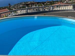 a close up of the top of a blue swimming pool at Vista Clara in Ponta do Sol