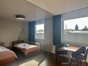 Postel nebo postele na pokoji v ubytování Gościniec PROMUS