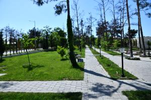 a path in a park with trees and grass at Park Naftalan Sanatoriya Kompleksi in Naftalan