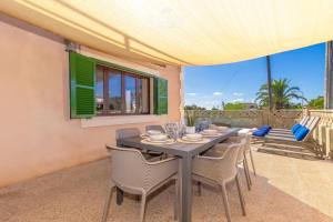 a dining room with a table and chairs at Villa Sa Llimonera by Slow Villas in Llombarts +33 photos