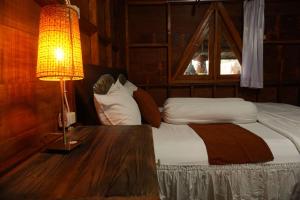 Postel nebo postele na pokoji v ubytování Villa Ilham Ketembong