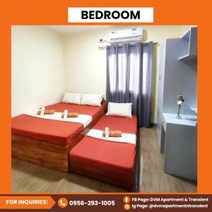 Giường trong phòng chung tại DVM Apartment & Transient