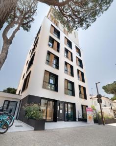 a building with bikes parked in front of it at Residence Cala Vela Tower in Riccione