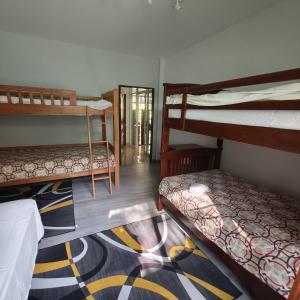 a room with three bunk beds and a hallway at New! MATA Garden resort Ao Nang in Ao Nang Beach +37 photos