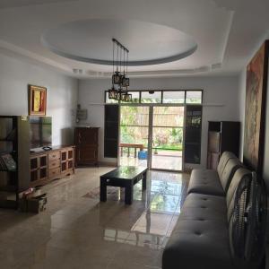 a living room with a couch and a table at New! MATA Garden resort Ao Nang in Ao Nang Beach