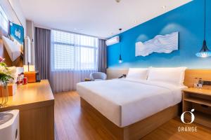 Ένα ή περισσότερα κρεβάτια σε δωμάτιο στο Orange Hotel Beijing Yongfeng Space City