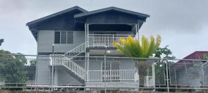 a house with a staircase in front of it at Cosy Homes in Suva - 2BR Family Unit in Suva