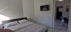 a bedroom with a bed in a room at Residence Niko in Pratica di Mare