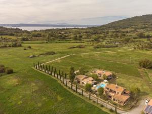 an aerial view of a house in a field with a fence at Apartment Casa Alessandro n-5 by Interhome in Montefiascone