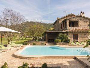 a house with a swimming pool in front of a house at Apartment Casa Domenico 2 by Interhome in Montefiascone +31 photos