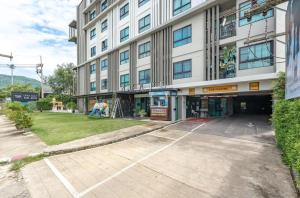an empty parking lot in front of a building at Z cape 1 one one in Laguna Phuket