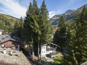 a view of a village with trees and mountains at Chalet Chalet Franca by Interhome in Madesimo
