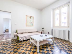a living room with a couch and a table at Holiday Home Guest House Viotti by Interhome in Castel Rocchero