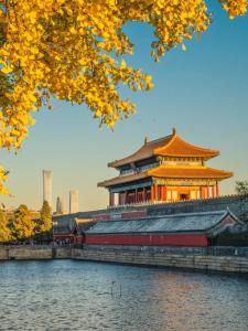 a chinese building with a lake in front of it at The Hutong Courtyard-Very close to Tiananmen Square,Forbidden City,Wangfujing Commercial Street,The hotel has a terrace,Free coffee,Free laundry,Near the subway st ation in Beijing