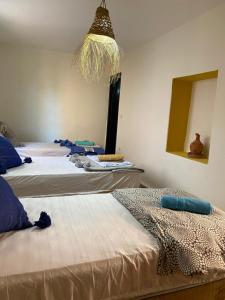 Ένα ή περισσότερα κρεβάτια σε δωμάτιο στο Yuba Surf Morocco