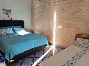 Ένα ή περισσότερα κρεβάτια σε δωμάτιο στο Kitty Roga en IG y FB