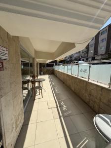a balcony with tables and chairs on a building at Alya otel in Burdur +8 photos