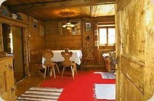 a dining room with a table and two chairs at Cad Maté 2 in Maloja