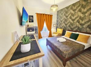 Un pat sau paturi într-o cameră la Green Studio