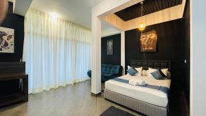 Postel nebo postele na pokoji v ubytování Blue Whale Resort & Kite Surfing