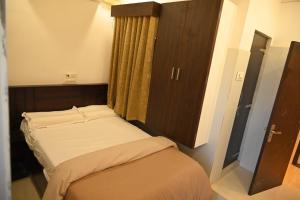 Voodi või voodid majutusasutuse BVR Dazzle Residency toas