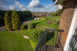 a balcony of a house with a view of a yard at Bells Hotel in Coleford