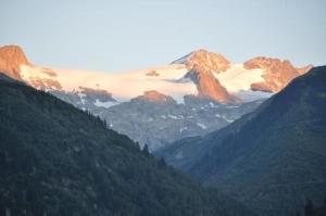 a view of a mountain range with snow covered mountains at Casa Caglina in Disentis +9 photos