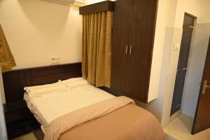 Voodi või voodid majutusasutuse BVR Dazzle Residency toas