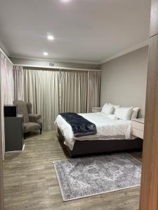 Postel nebo postele na pokoji v ubytování BEE Boutique Lodge