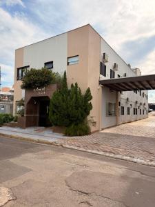 a building on the side of a street at Colonial Hotel in Campo Grande