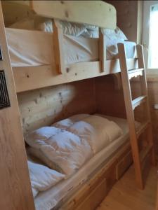 a couple of bunk beds in a room at Ca' degli Scoiattoli in Cortina dʼAmpezzo