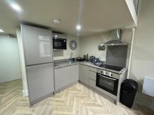 Kuchyň nebo kuchyňský kout v ubytování Central Leeds Apartment Oasis + 2 fotografie