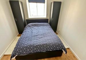 En eller flere senge i et værelse på Watford Flat Near London