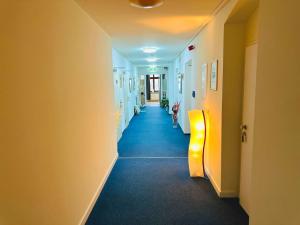 a hallway of a hospital with at Hotel an der Rennbahn in Dresden +3 photos