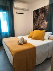 Postel nebo postele na pokoji v ubytování Apartamentos Carmen Baja 35