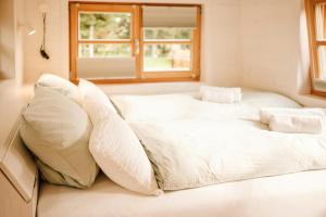 Ένα ή περισσότερα κρεβάτια σε δωμάτιο στο Modernes Tiny House Im Oldenburger Münsterland