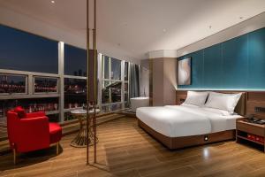 Postel nebo postele na pokoji v ubytování Xili Tiancheng Hotel Nanbin Road Branch