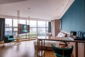 TV a/nebo společenská místnost v ubytování Xili Tiancheng Hotel Nanbin Road Branch