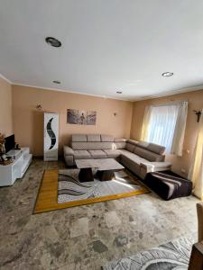 a living room with a couch and a table at Apartman Nedo Međugorje in Međugorje