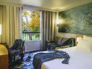 Postel nebo postele na pokoji v ubytování Hotel Novotel Domaine de Maffliers - Paris Val-d'Oise