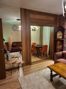 a living room with a couch and a table at Grand Albi Apartament in Gjakove